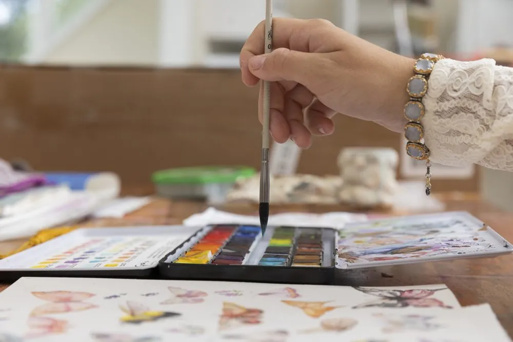 Watercolor palette and brush in the studio