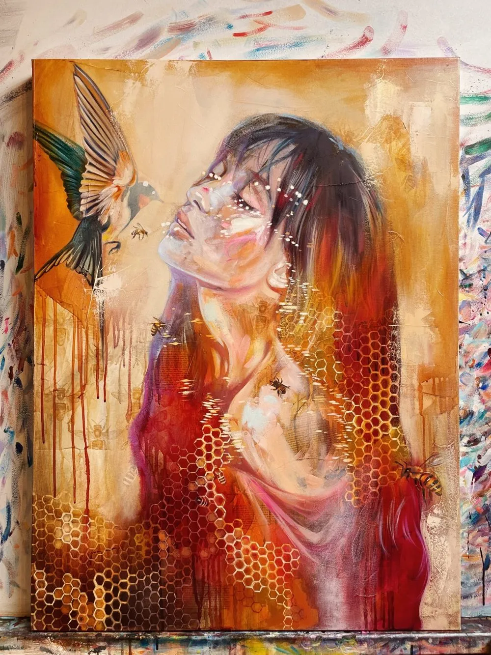 Painting of a girl beside a sacred animal messenger in soft light