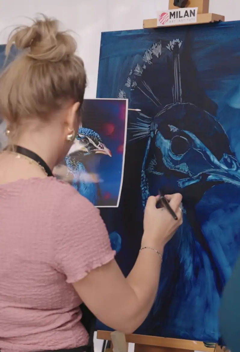 Blue and white underpainting beside the source photo and the contestant who chose it