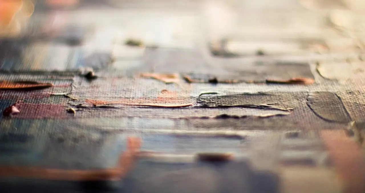 Close up of a finished painting surface in warm earth tones with a soft even sheen
