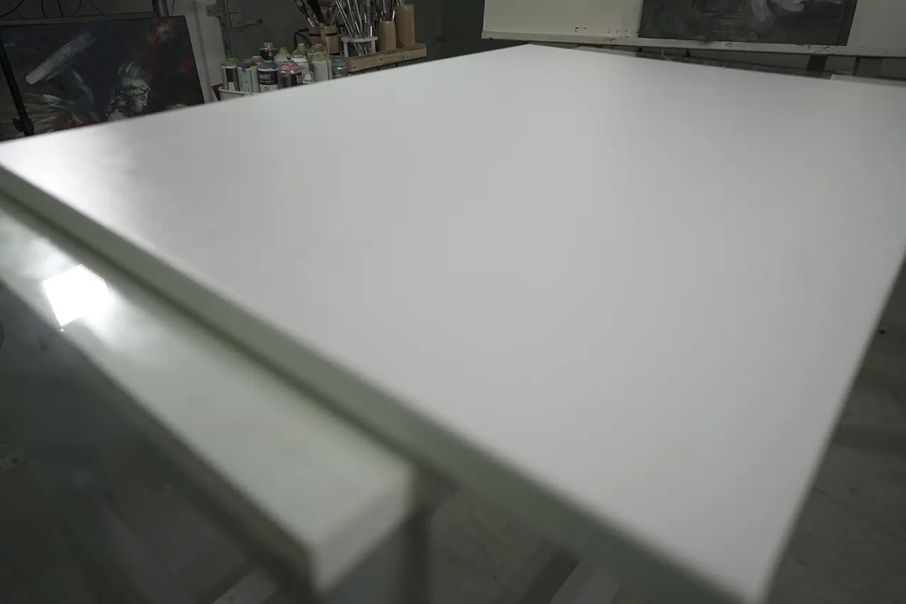 A stretched canvas seen from the side showing the depth of its gallery wrapped edge and wooden frame