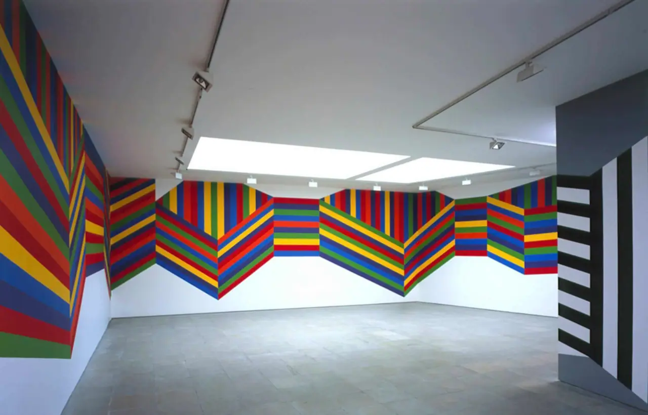 Sol LeWitt wall drawing built from bands of flat saturated color forming clean geometric shapes
