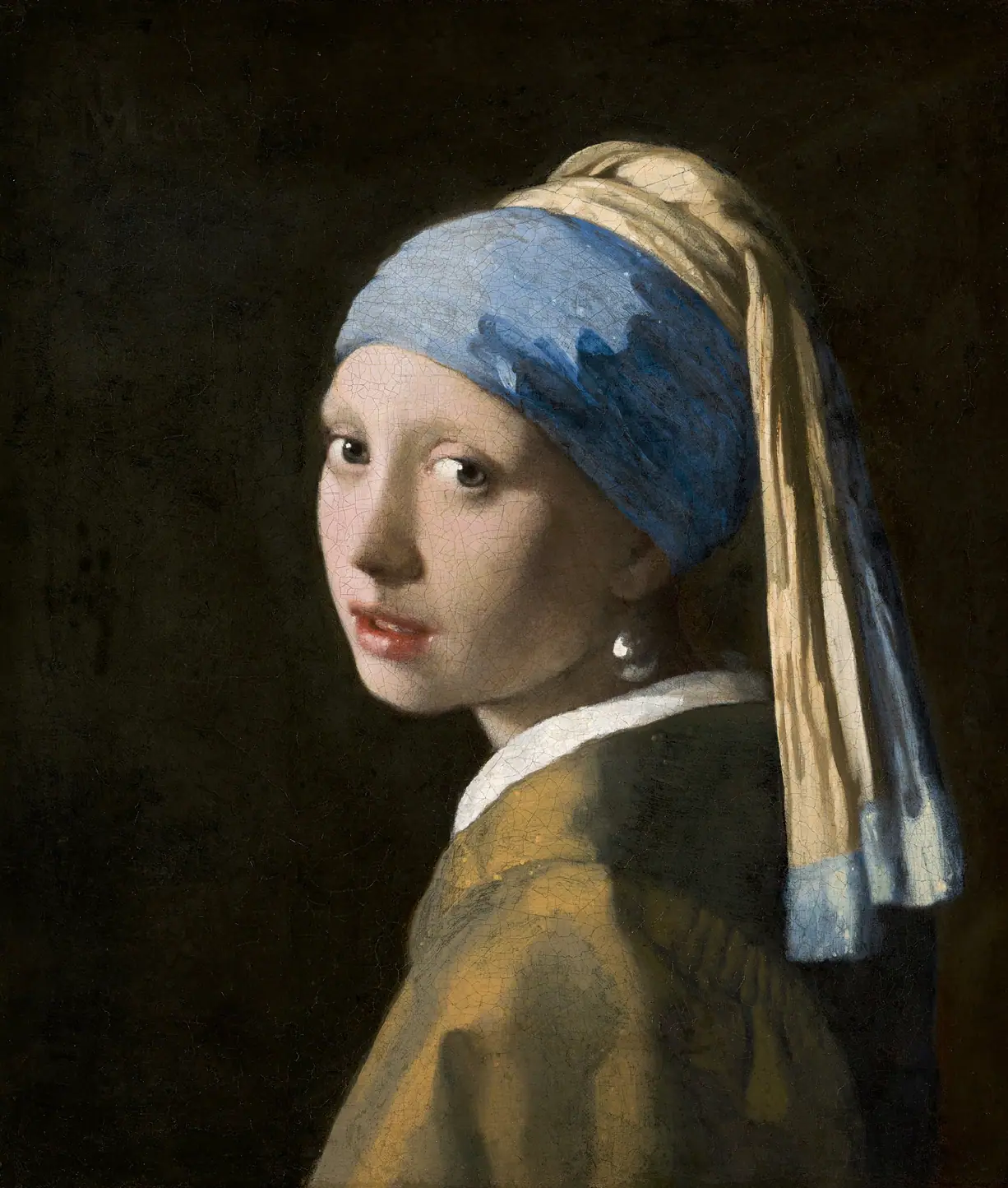 Girl with a Pearl Earring by Johannes Vermeer, a young woman in a blue and gold turban glancing over her shoulder