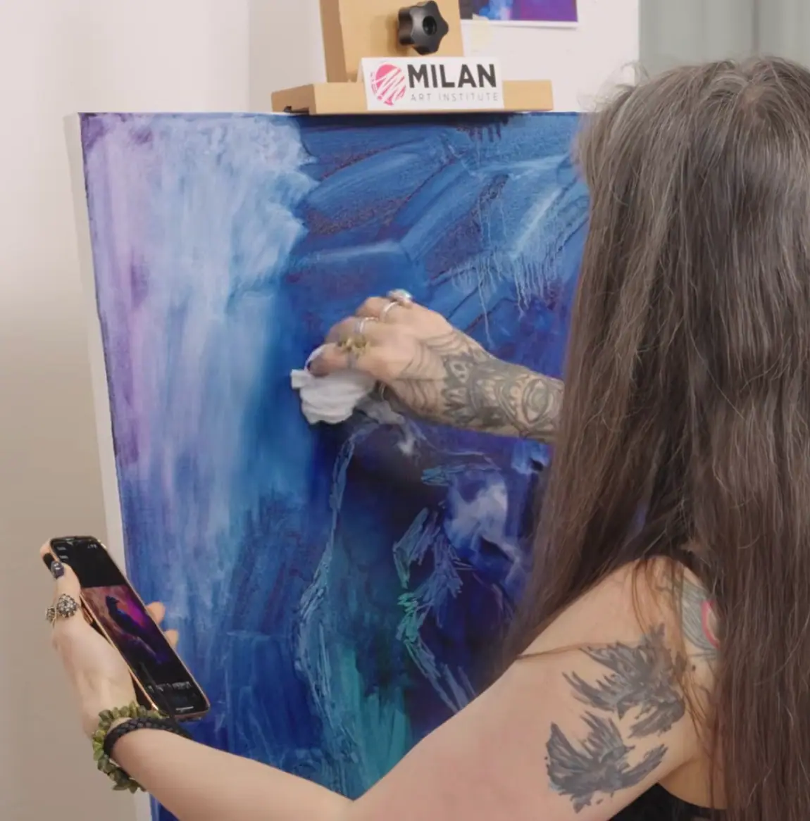 Blue and purple underpainting next to the reference photo it was built from