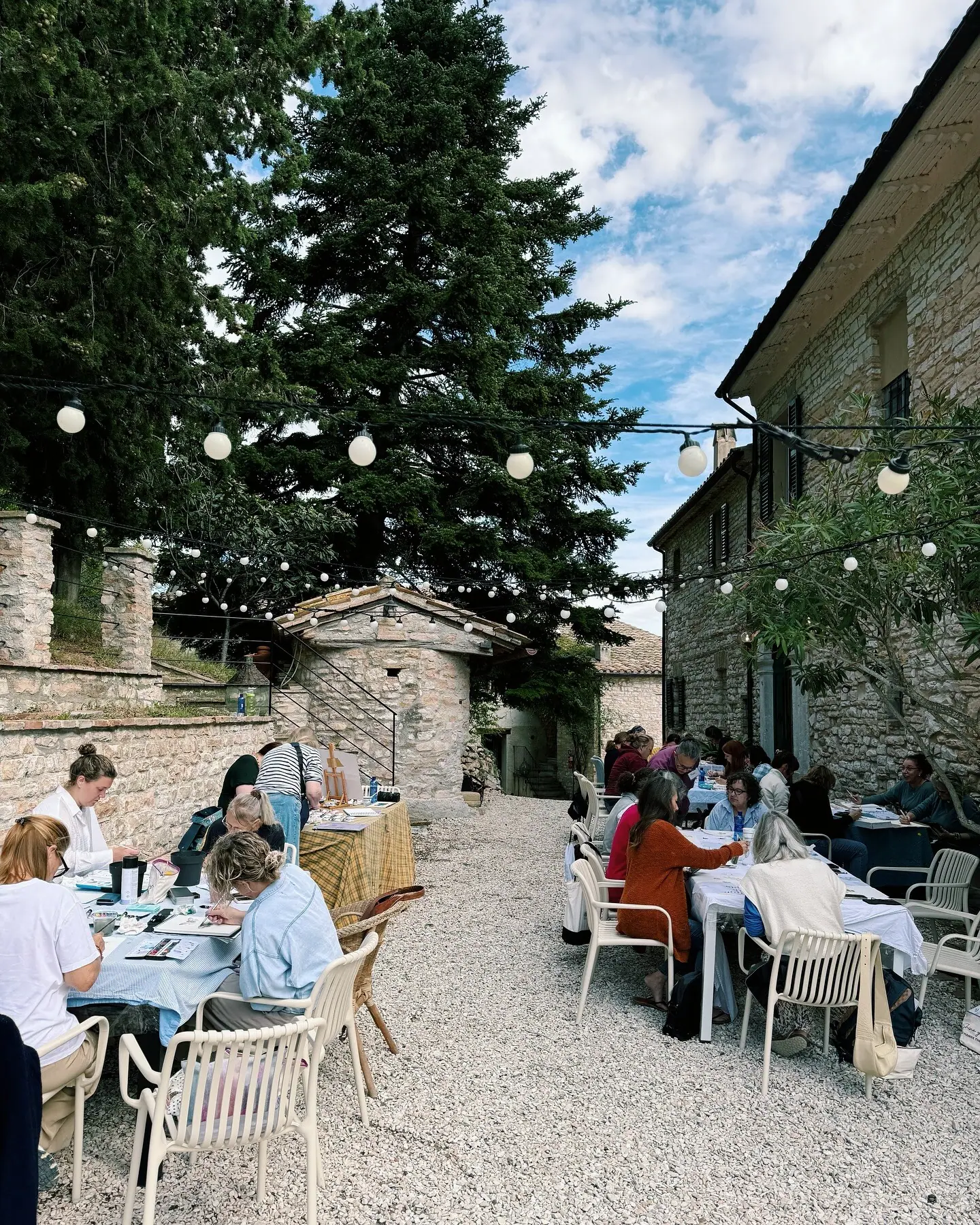 Artists painting together at a Milan Art retreat in Italy