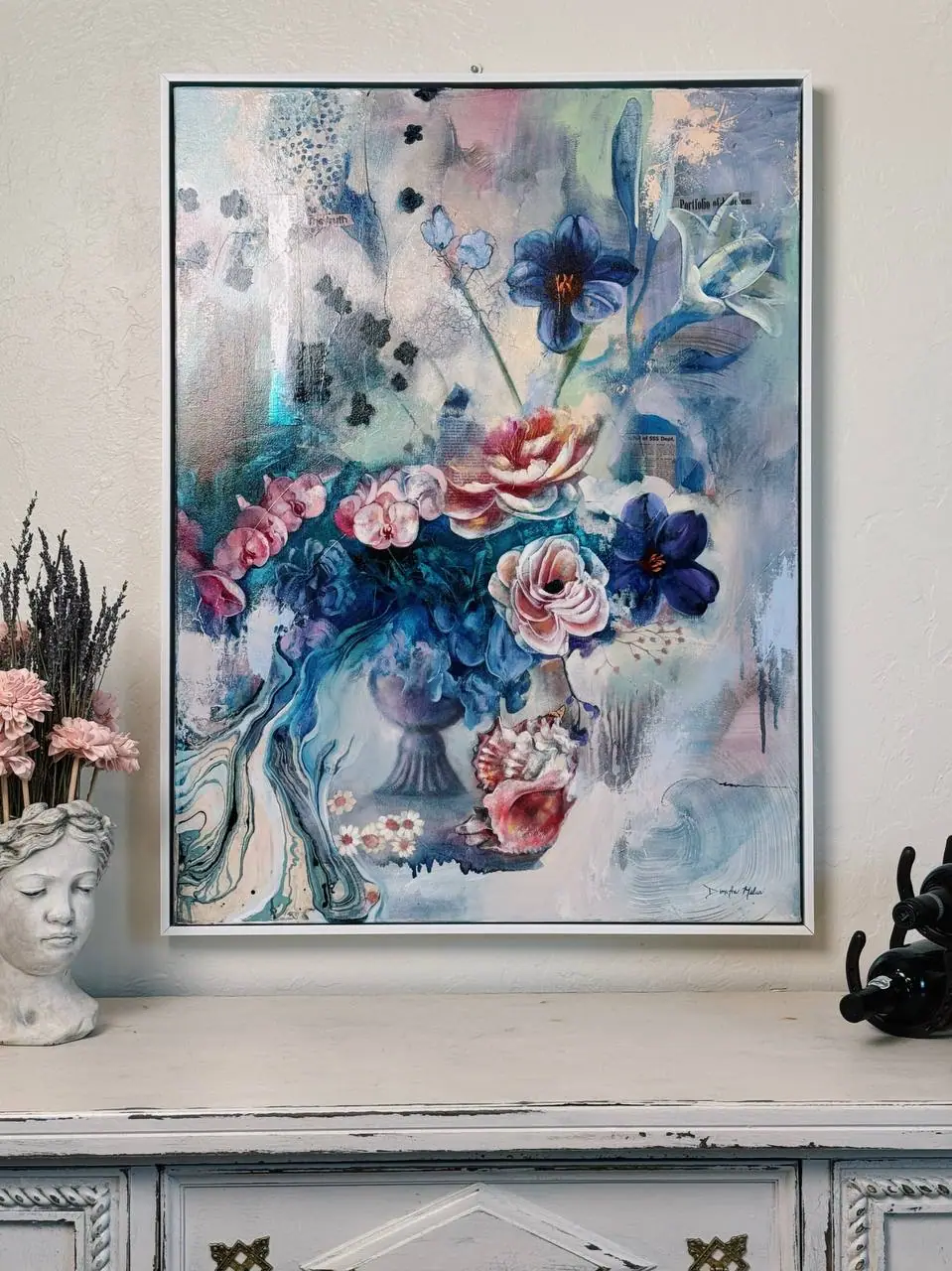 Soft still life painting of a vase of flowers in blue and peach