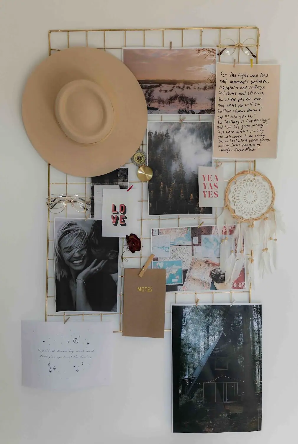 A tall inspiration board arranging photographs and clippings into moods and color groups for a painting